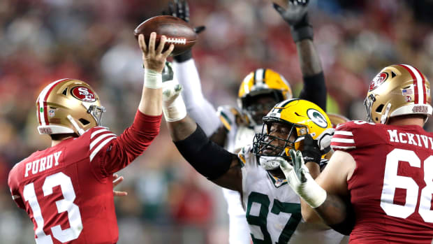 Green Bay Packers defensive tackle Kenny Clark (97) pressures San Francisco 49ers quarterback Brock Purdy (13) in the third quarter during their NFC divisional playoff football game Saturday, January 20, 2024, at Levi's Stadium in Santa Clara, California.  